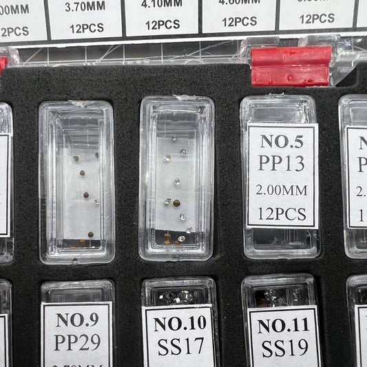 Set of 144 artificial glass stones in 12 sizes for watch dials and cases, enhancing accessory designs.