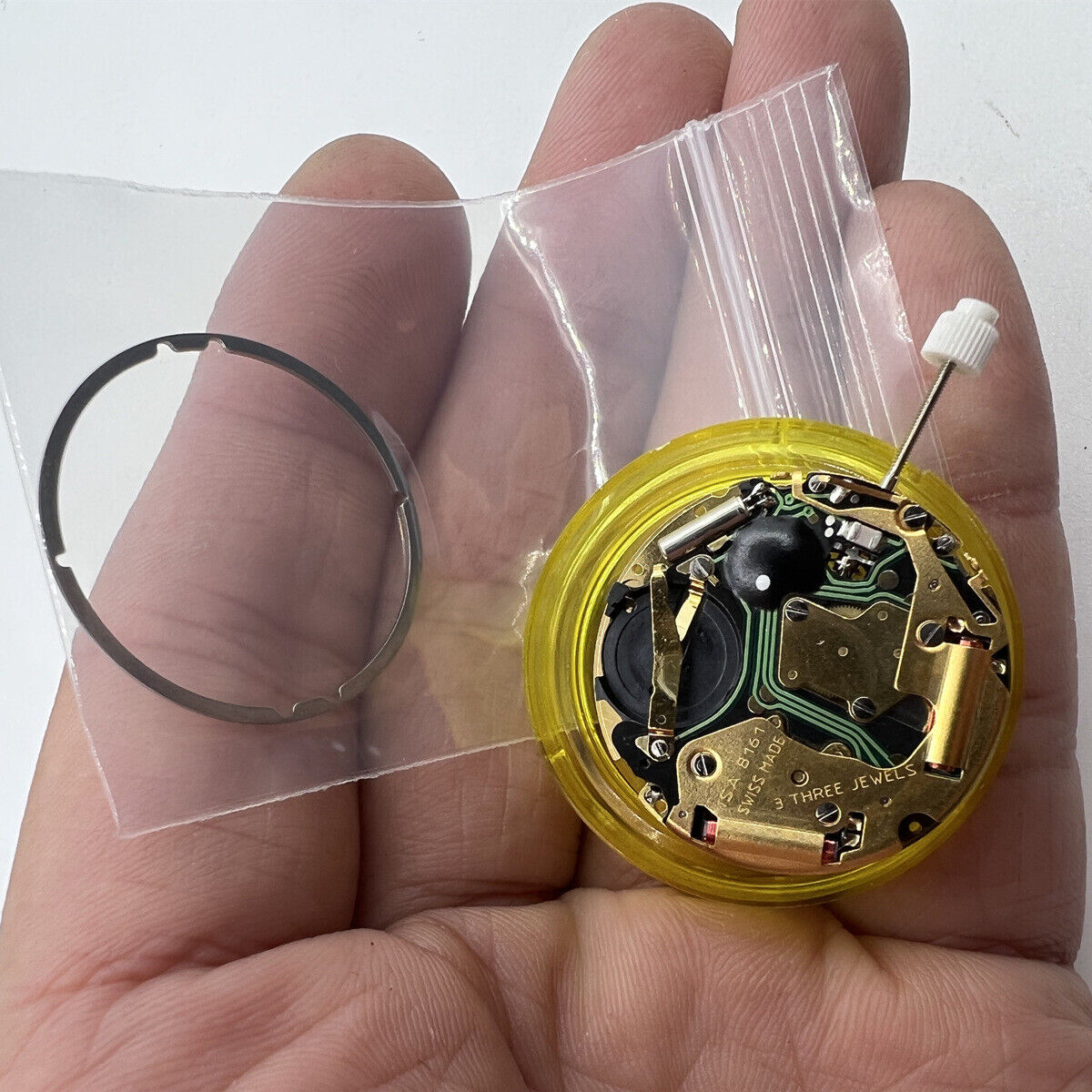 ISA 8161 golden watch part with Swiss quartz movement and three hands for accurate timekeeping.