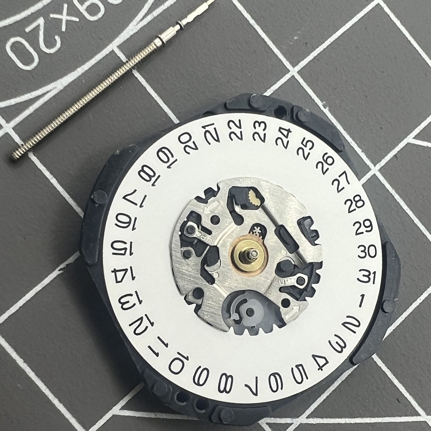 Hattori Epson TMI VX3K quartz watch movement with date at 3, precision Japan-made mechanism.