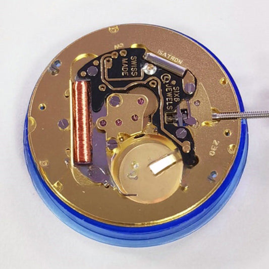 Close-up of Swiss Made ISA 230 quartz watch movement with 3 hands and single calendar at 3, premium watch part.