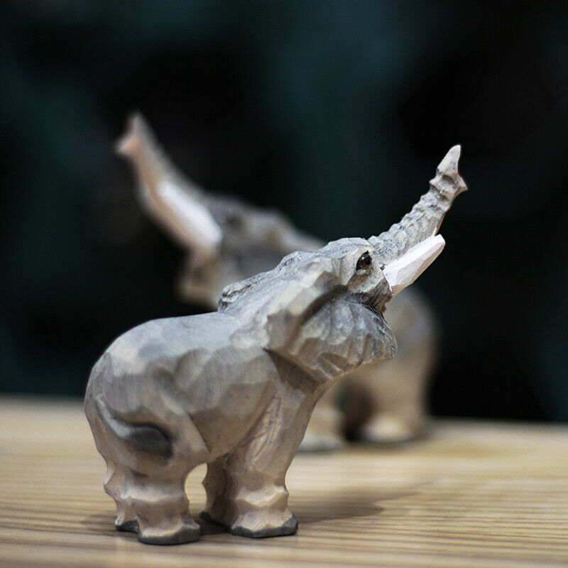 Handcrafted upturned nosed elephant wooden figurine, perfect for charming home decor and gift ideas.