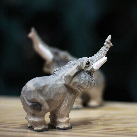 Handcrafted upturned nosed elephant wooden figurine, perfect for charming home decor and gift ideas.