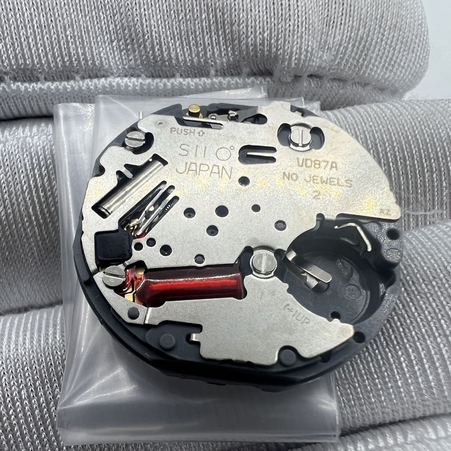 Hattori Epson TMI VD87 quartz watch movement showcasing precise internal components and expert Japanese craftsmanship.