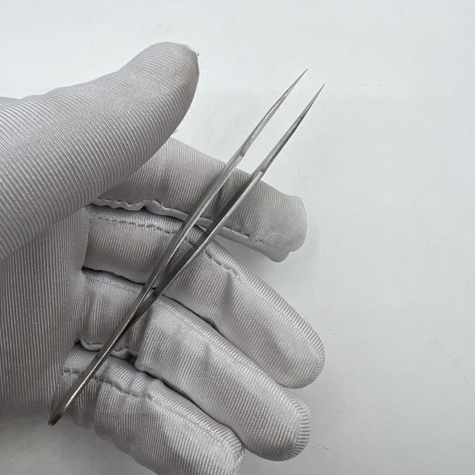 Swiss Made Horotec MSA12.302-4 antimagnetic steel tweezers for precise watch repair and accessory handling.