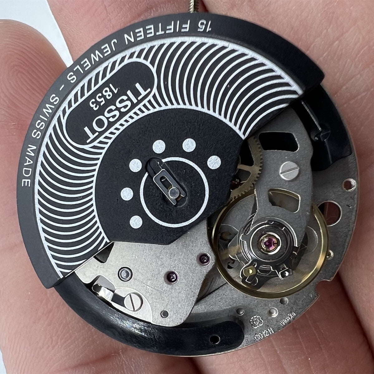 Tissot ETA C01.211 chronograph mechanical watch movement with black 1853 dial, precise timekeeping accessory.