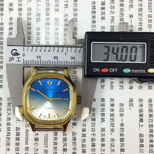 33mm Shanghai watch with blue dial, golden nail markers, square case, manual mechanical movement, 17 jewels.