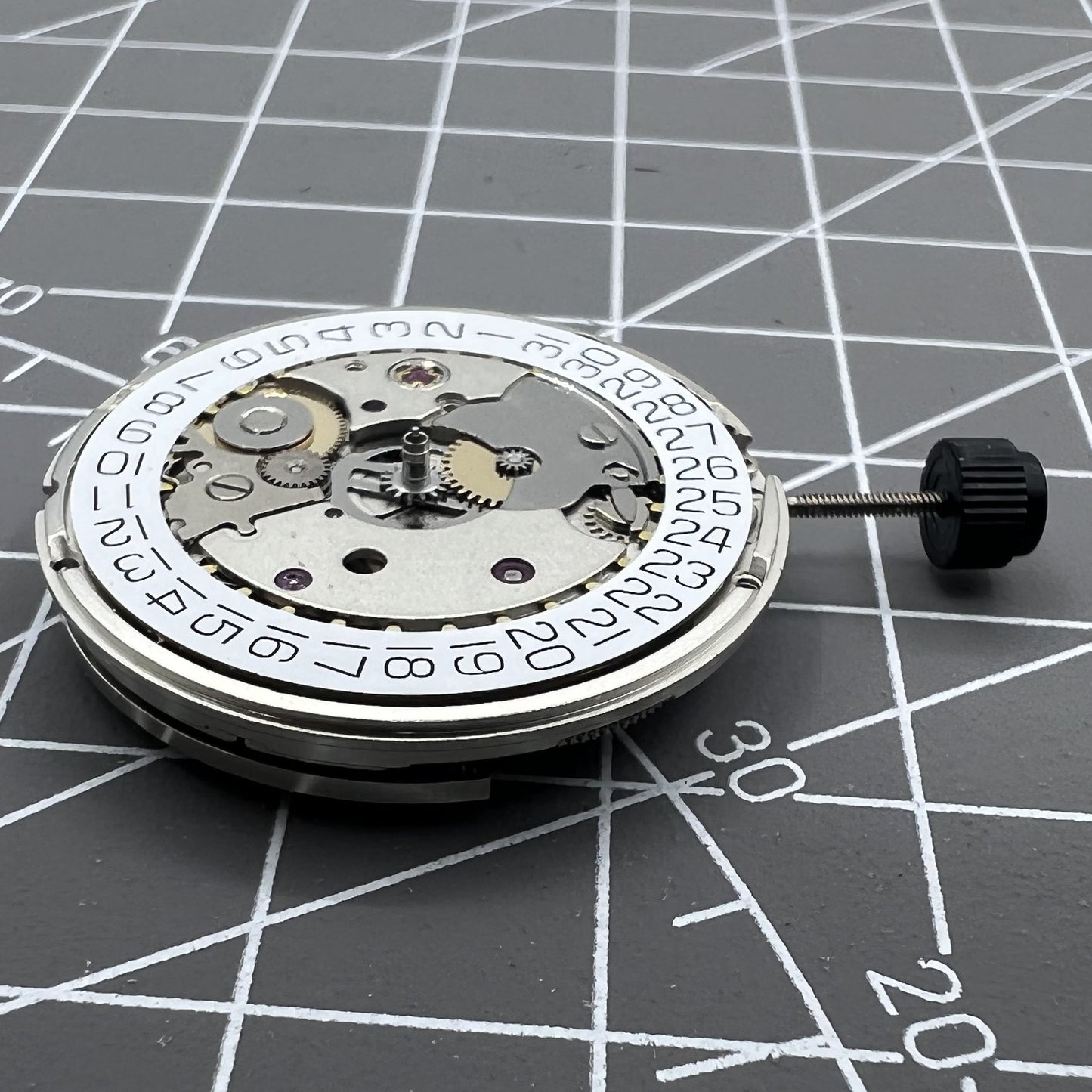 Silver ETA SW200-1 automatic watch movement, high-precision mechanical replacement for watch repair.
