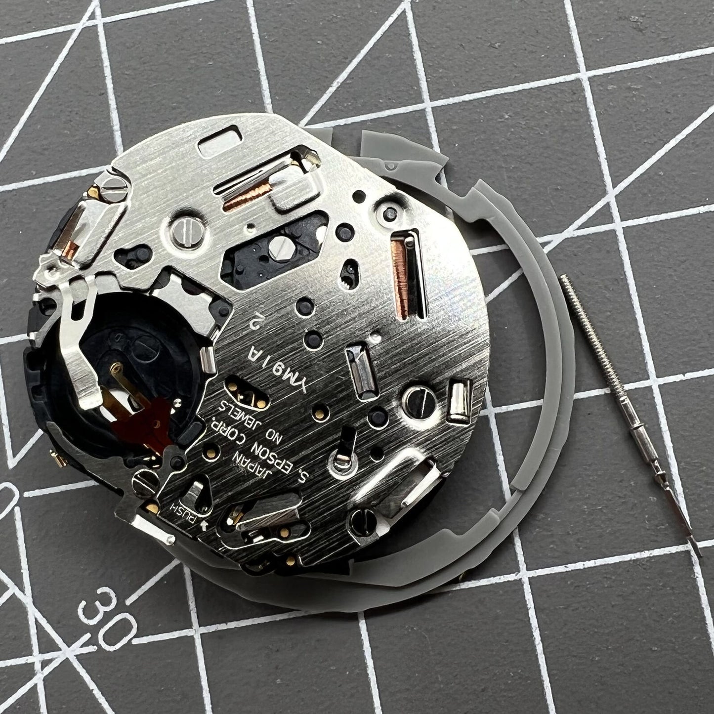 Japan Hattori Epson TMI YM91A quartz watch movement with date display at 3 o'clock, precision made