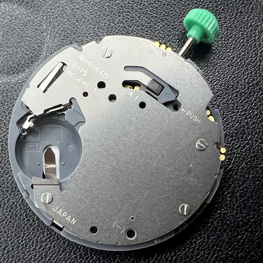 Miyota 0T45 quartz movement with date at 3, precise Japanese watch accessory for repairs.