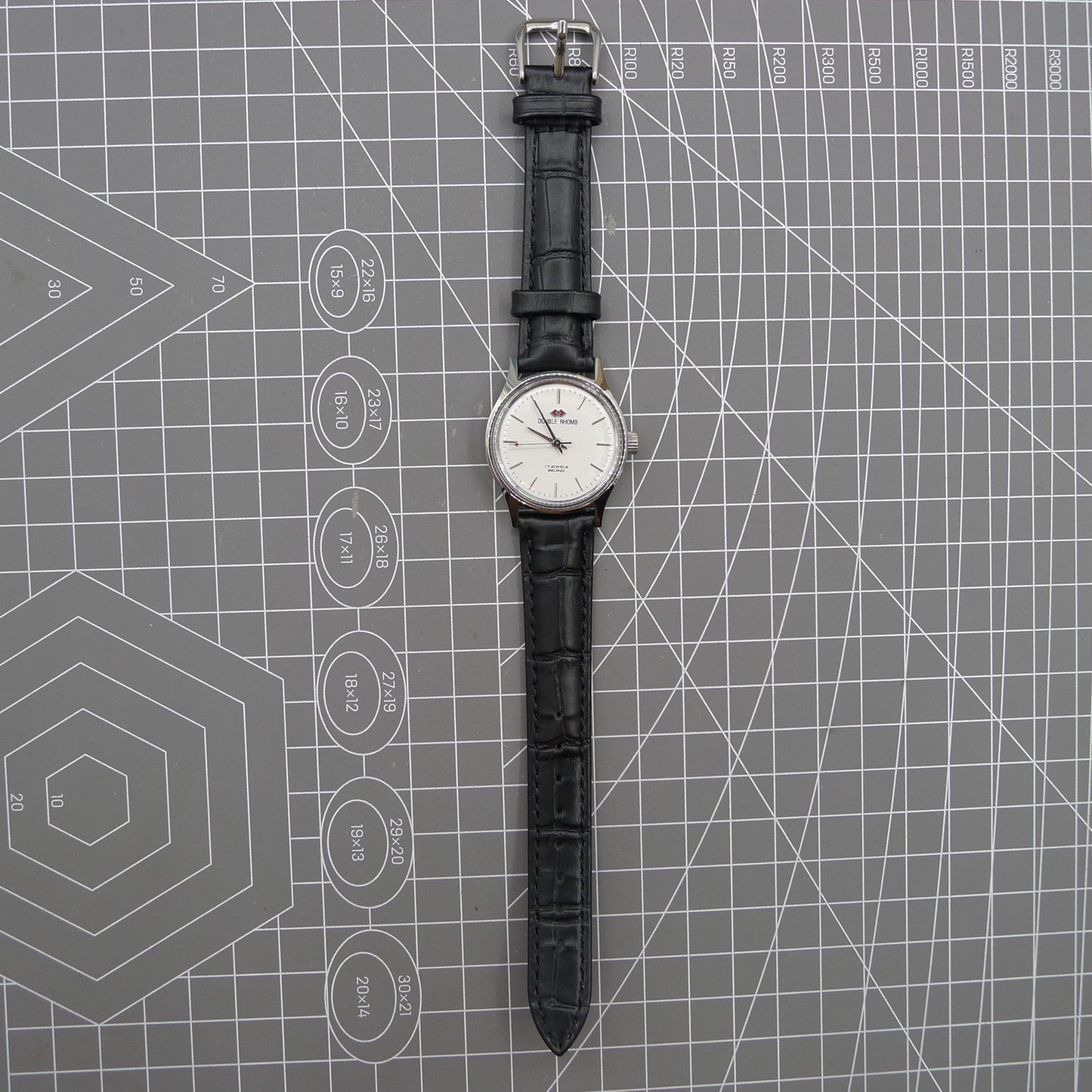 Beijing 31mm manual mechanical watch with silver case and double rhomb dial, classic Chinese craftsmanship.