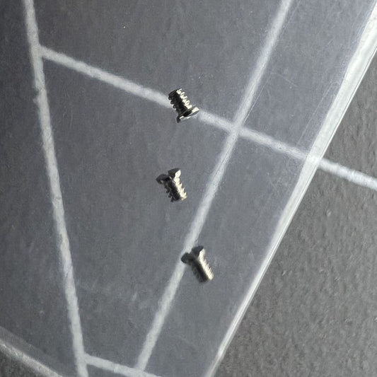 Close-up of generic brand screws for SA100 rotor oscillating weight, essential watch accessory parts.