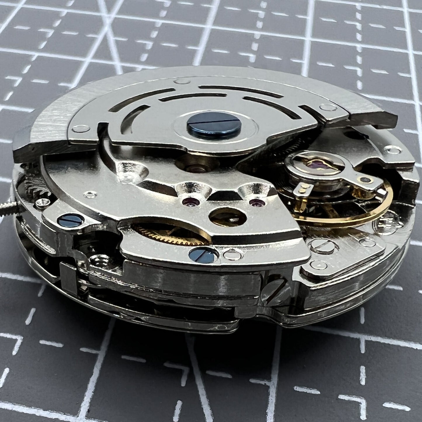 DG2813 automatic watch movement showing three large hands and small seconds subdial at 6 o'clock.