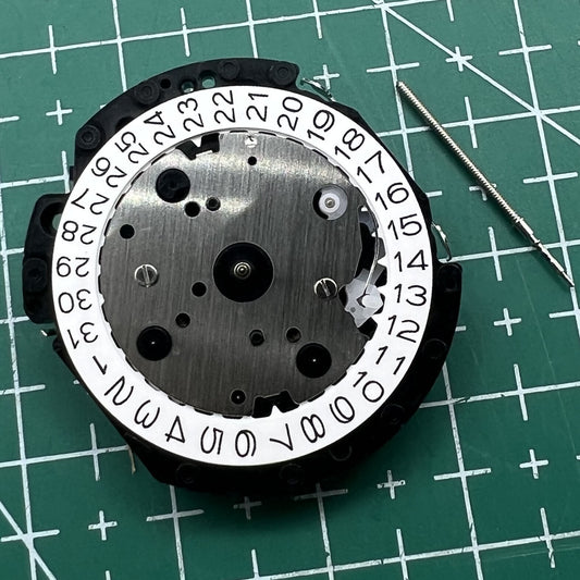 Hattori Epson VD53C quartz watch movement with date display at 3/6/4:30 for precise timekeeping