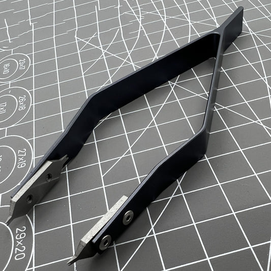 Stainless steel spring bar tweezer by 7825 for precise lug removal and watch strap fitting.