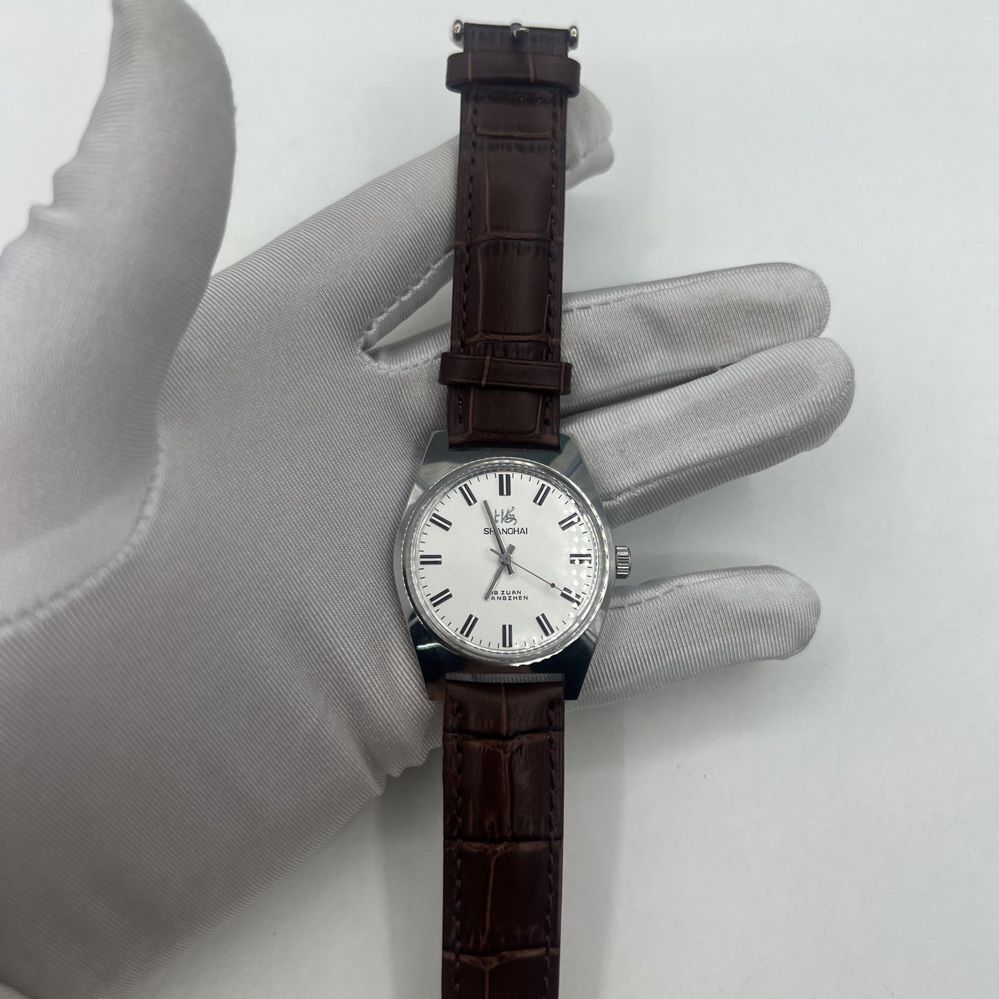 Shanghai Factory 38mm manual mechanical watch with white dial, 3 hands, 19 jewels for precise timekeeping and classic style.