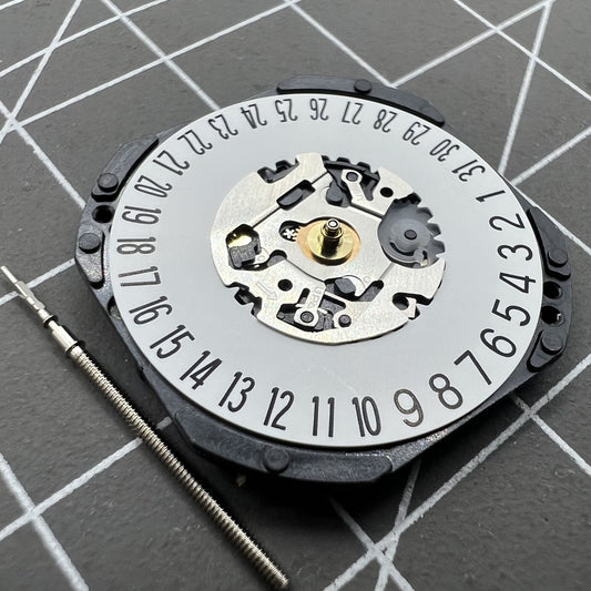 Hattori Epson TMI VX3K watch movement showing date display at 6 o'clock position, quartz precision.