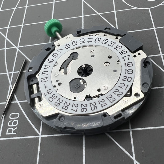 Miyota 0T45 quartz watch movement with date at 3, precision Japanese craftsmanship.