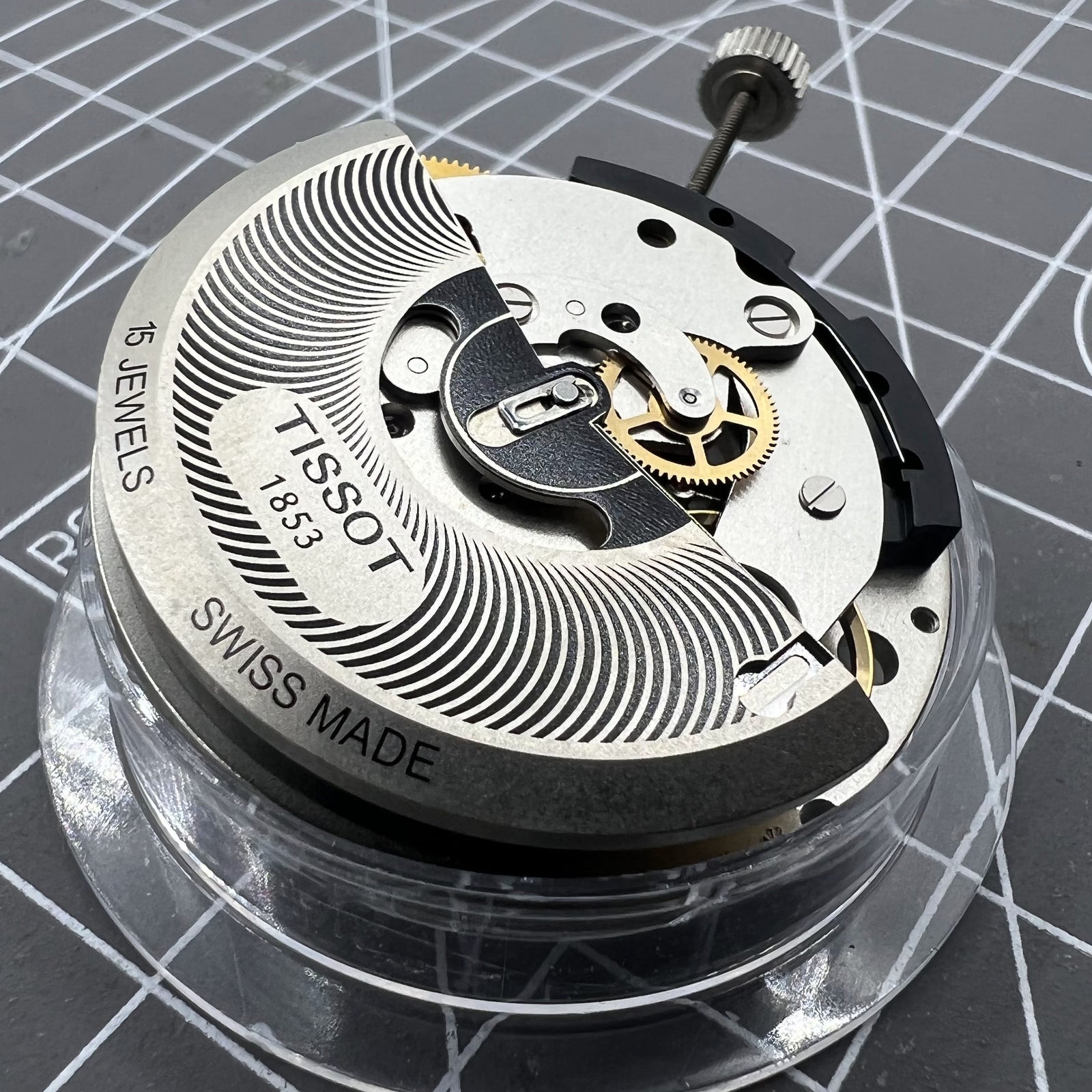 Tissot ETA C01.211 chronograph movement with white dial, precise Swiss watch accessory for repairs.