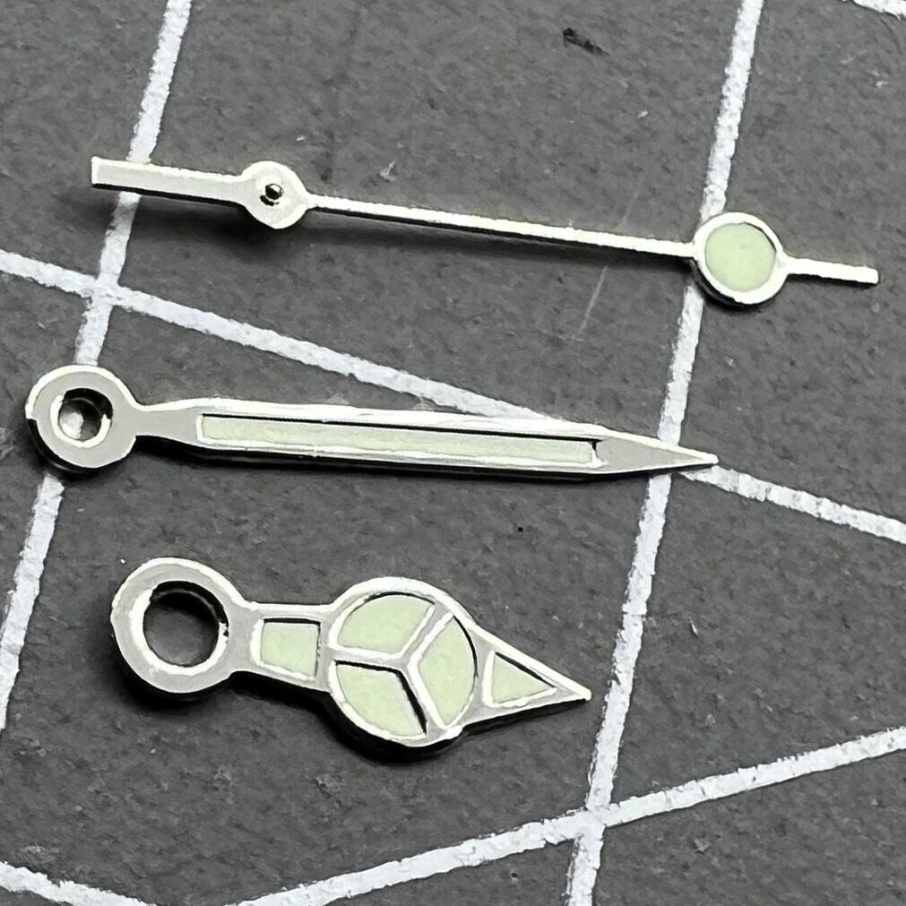 Silver trim green lume watch hands set for Miyota 2035 movement, luminous and precise.