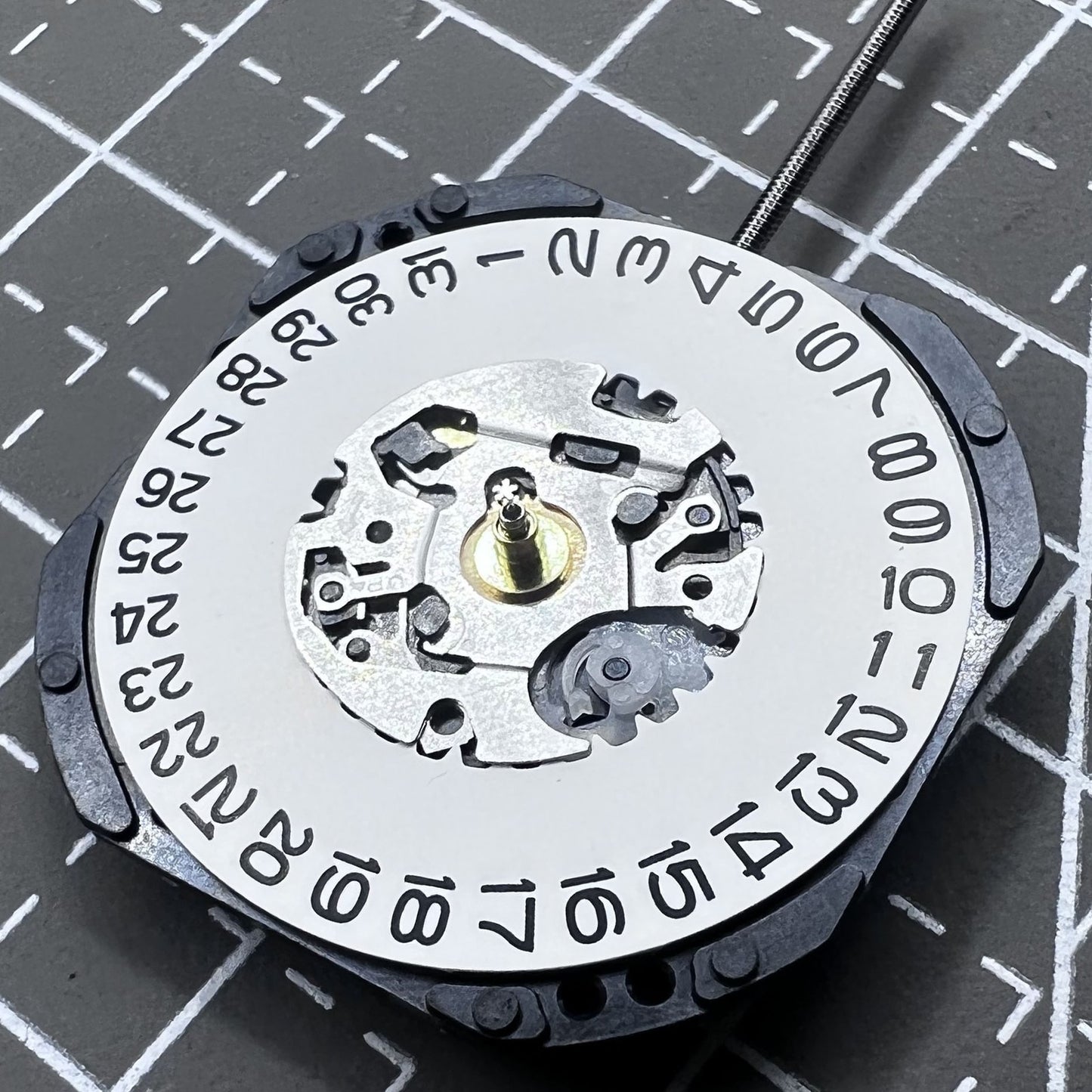Seiko 7N32C Quartz watch movement showing three hands and single date at 3 o'clock for watch accessories.