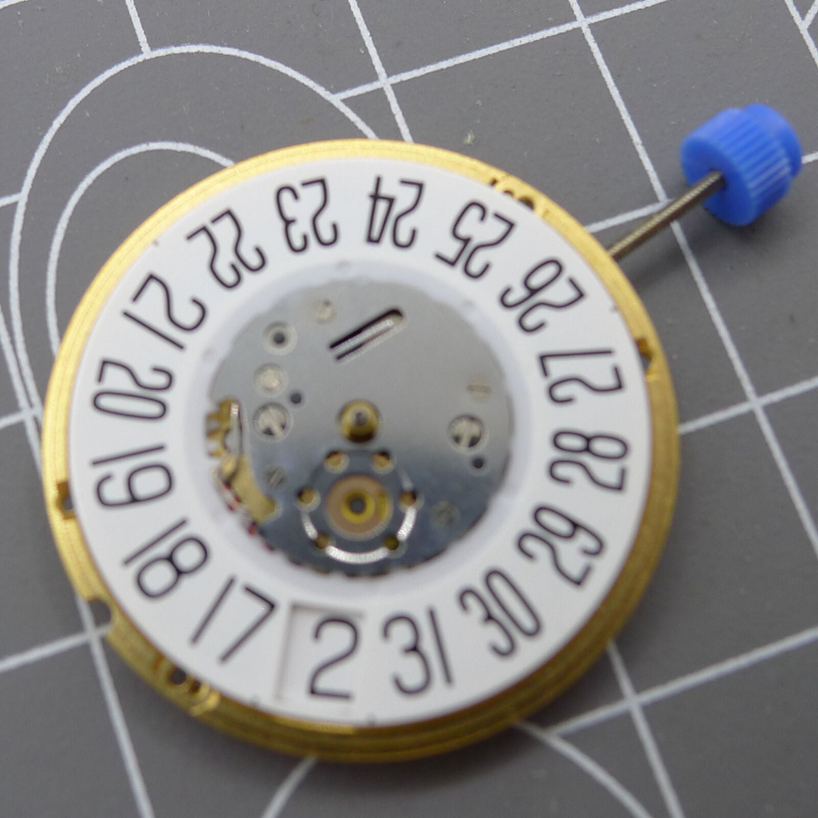 Swiss ETA F06.161 quartz watch movement with white dial, 3 hands, and date display at 6, for precise timekeeping.