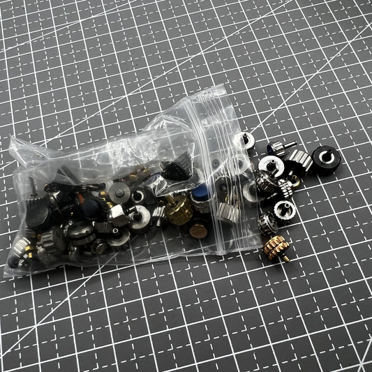 Assortment of 100 watch crowns in multiple sizes, perfect for watch repairs and replacements.