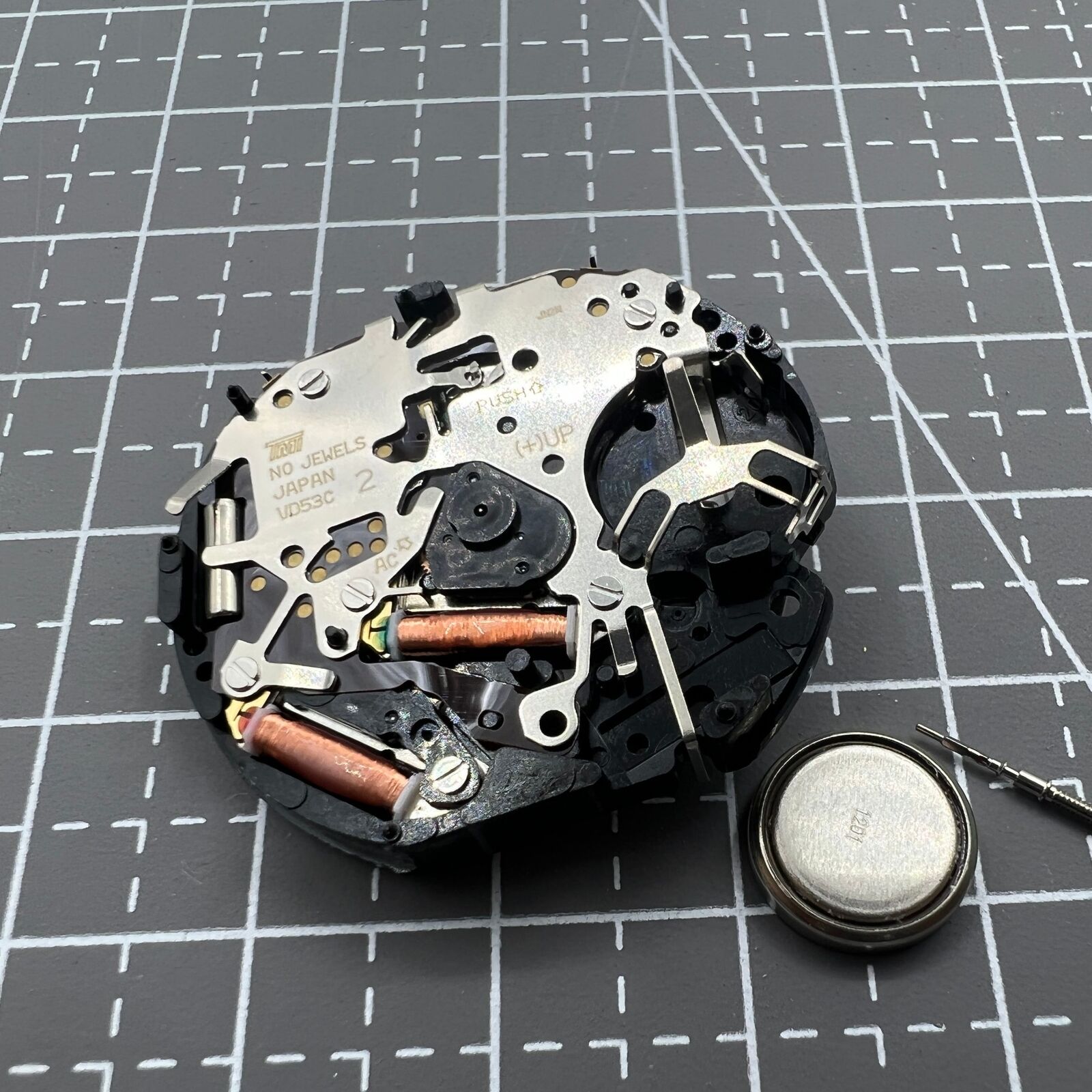 Hattori Epson VD53C quartz watch movement with date at 6 o'clock, Japanese precision timekeeping.