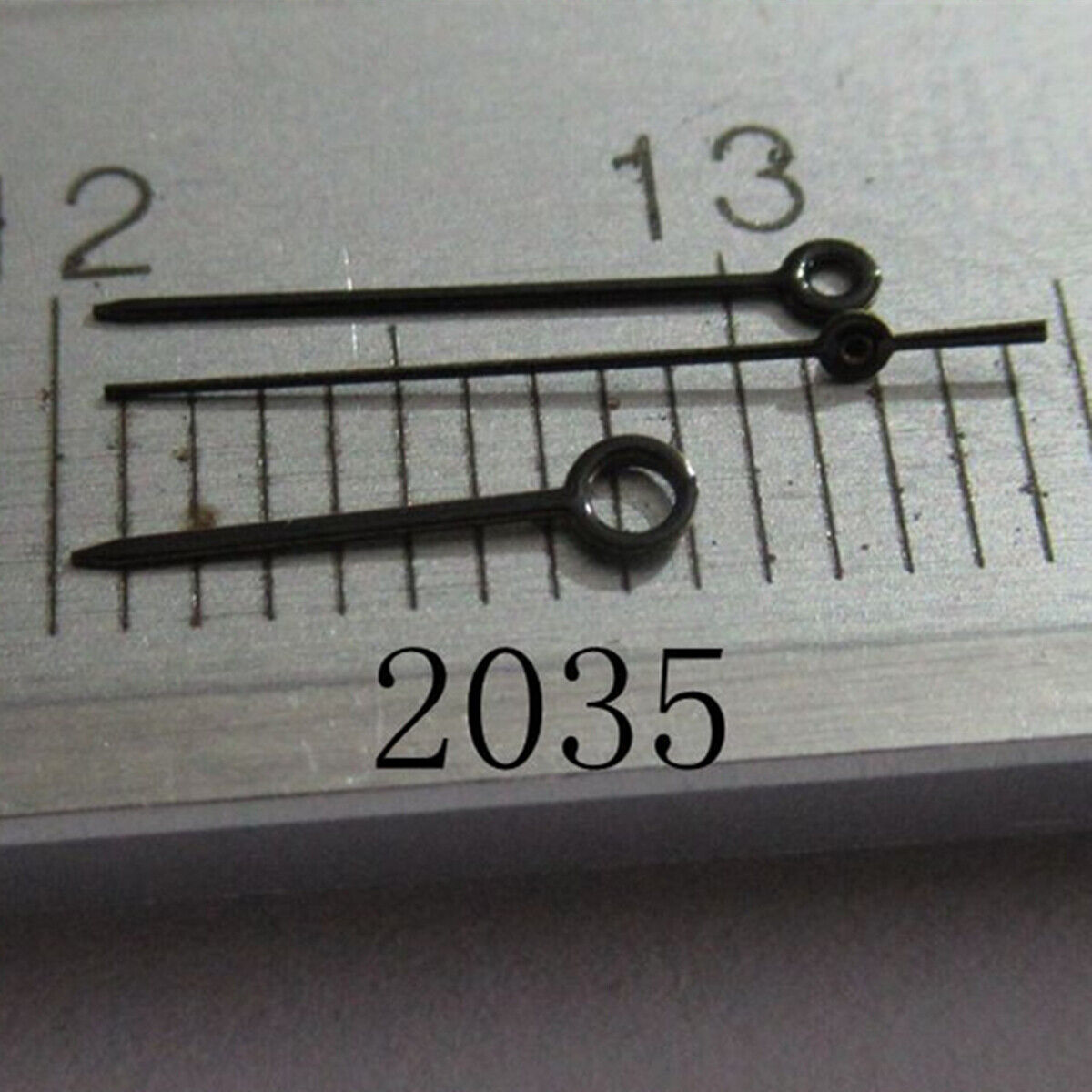 Black painted needle shape watch hands set for Miyota 2035 series, precise fit accessory.
