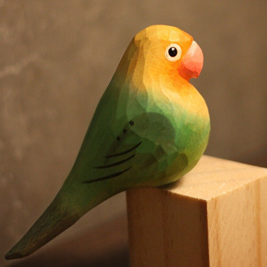 Handmade wooden Agapornis Fischeri figurine in green and yellow, perfect decorative watch accessory.