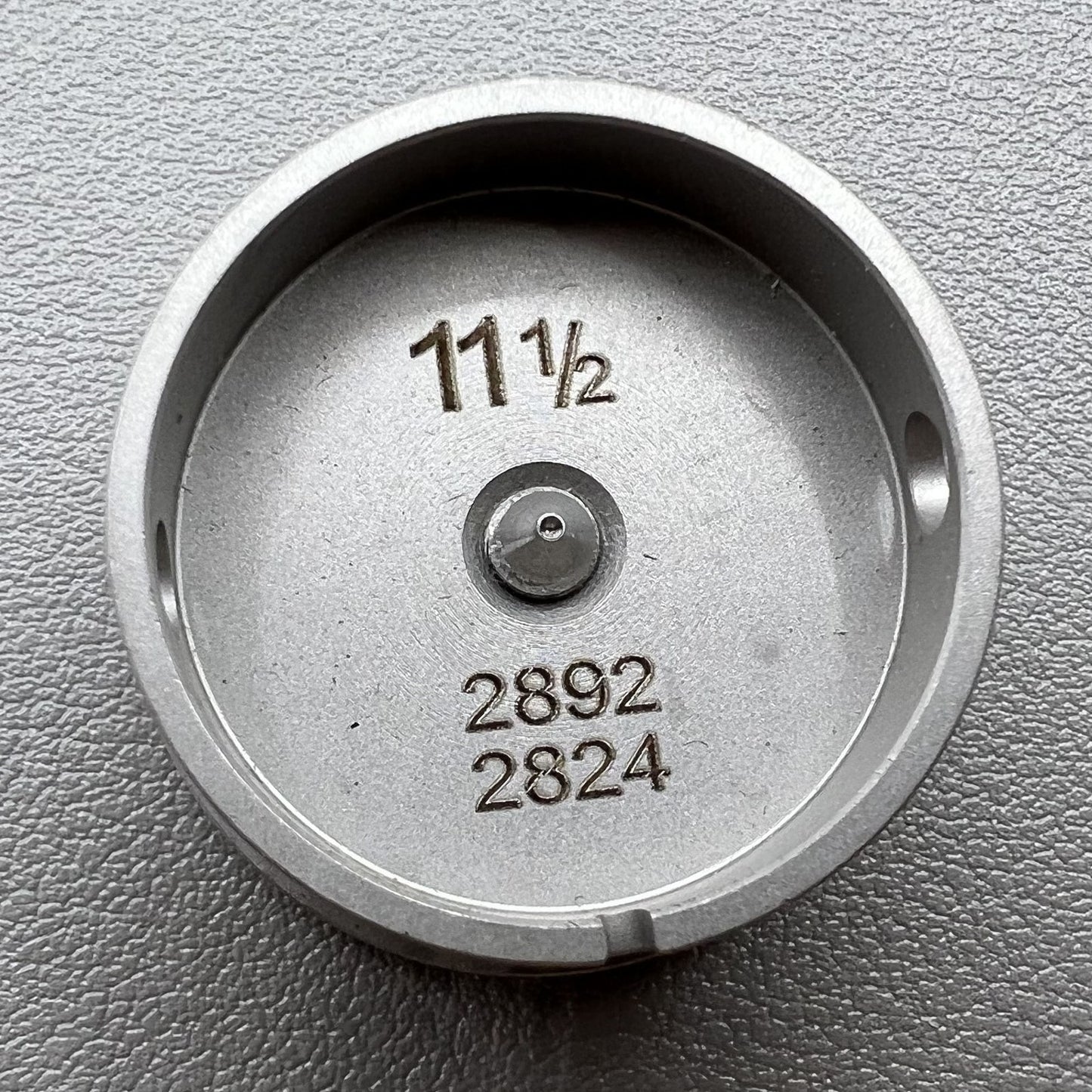 Size 11-1/2 Ligne Eta 2892/2824 movement holder with center screw for watch repair and assembly.
