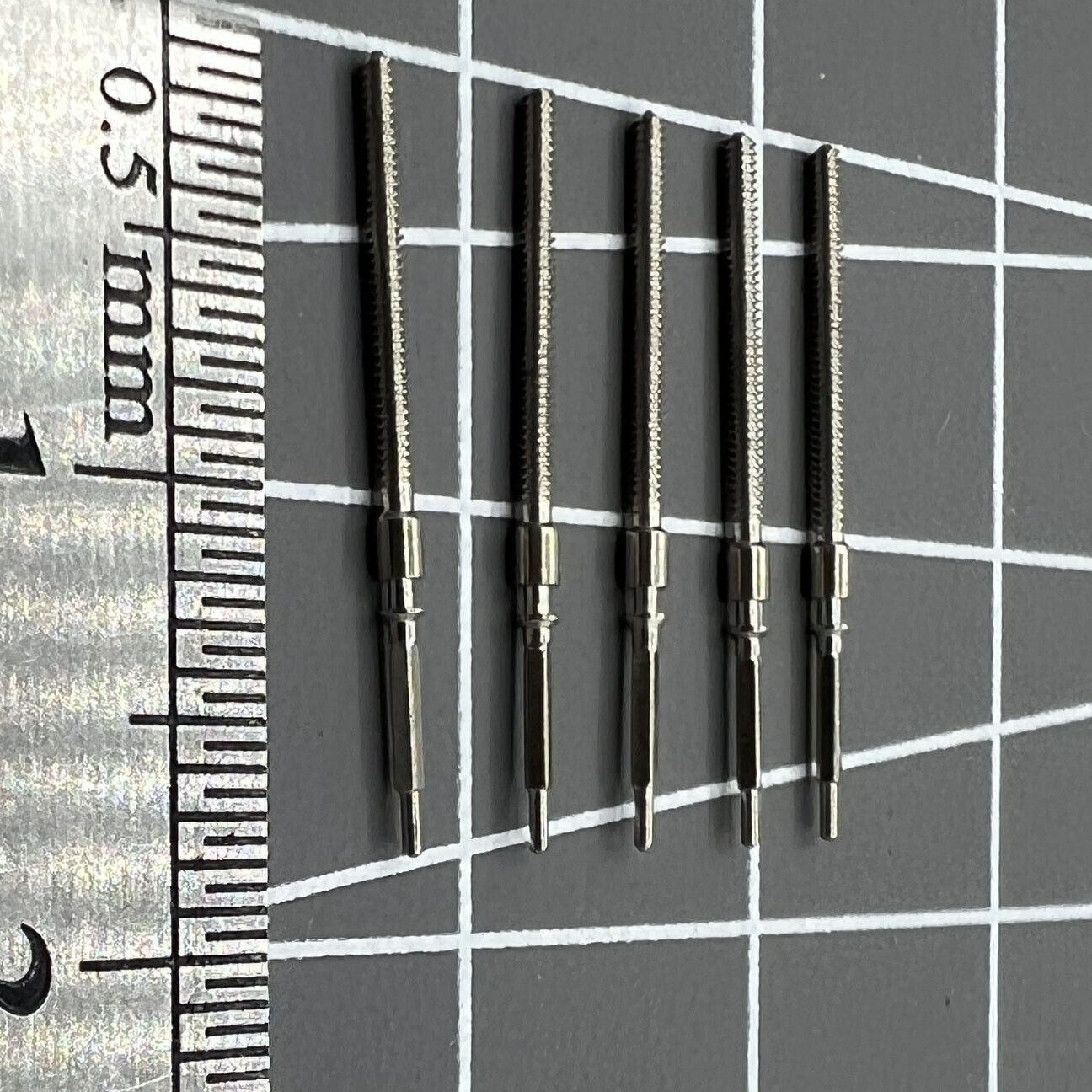 Set of 5 winding stems for 6309 watch movement, compatible spare parts for Seiko watch repairs.