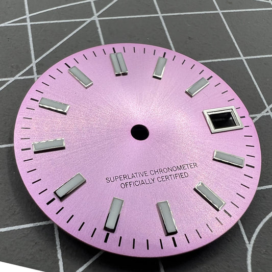 Pink watch dial with green luminous markers, polished metal finish, compatible with NH35 movement.