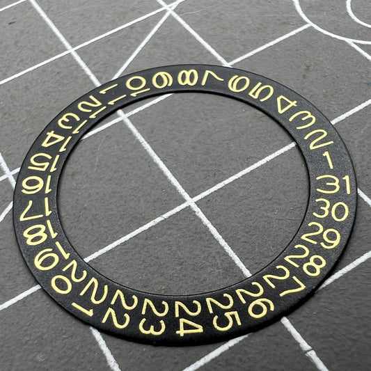 Golden date disk displaying characters on black background for Seiko NH35 NH36 movements