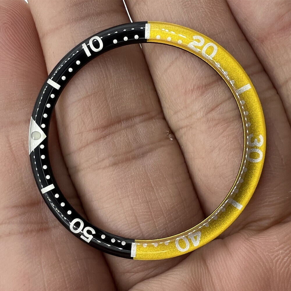 Black yellow circular arc bevel aluminum bezel insert for 39mm watch, enhancing style and durability.