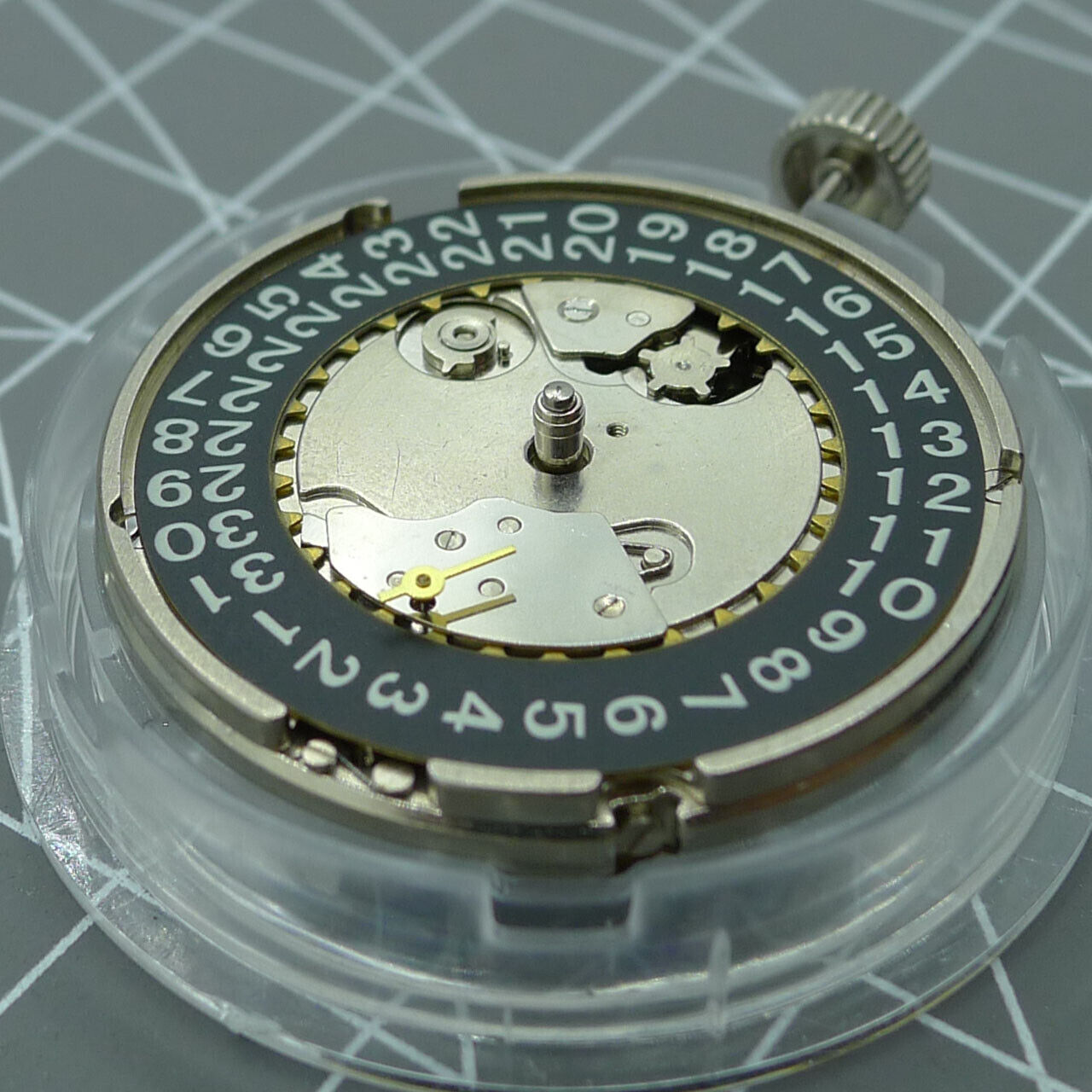 Black Seagull ST2555 automatic watch movement showing second hand at 9H, perlage finish, and big date display.
