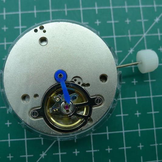 Wholesale Man Shanghai watch accessory showcasing automatic mechanical movement with hollow balance wheel at 6 o'clock.