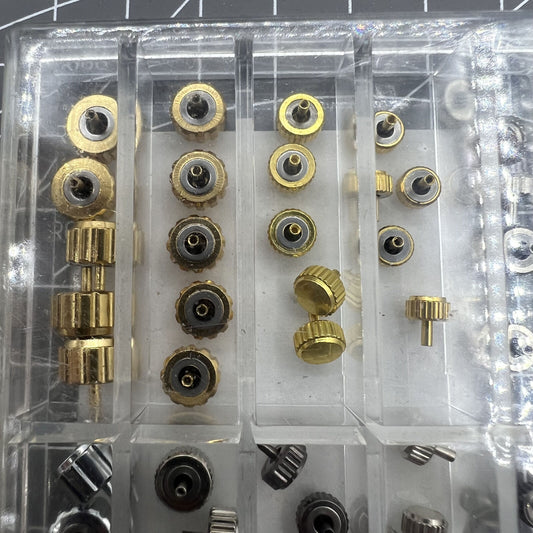 1. Gold, silver, and black waterproof watch crowns assortment for precise repairs.