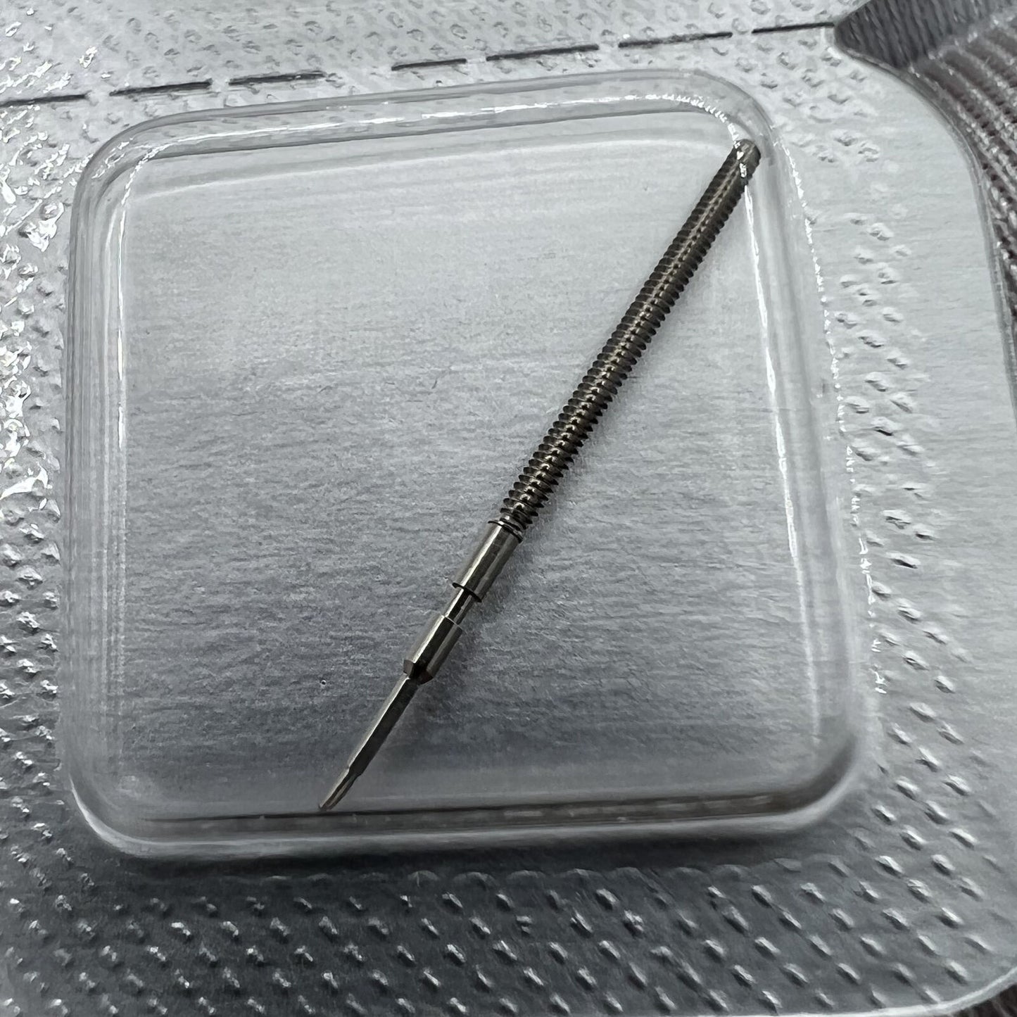 Swiss Made Ronda 1015 winding stem for precise watch repair and replacement accessories.