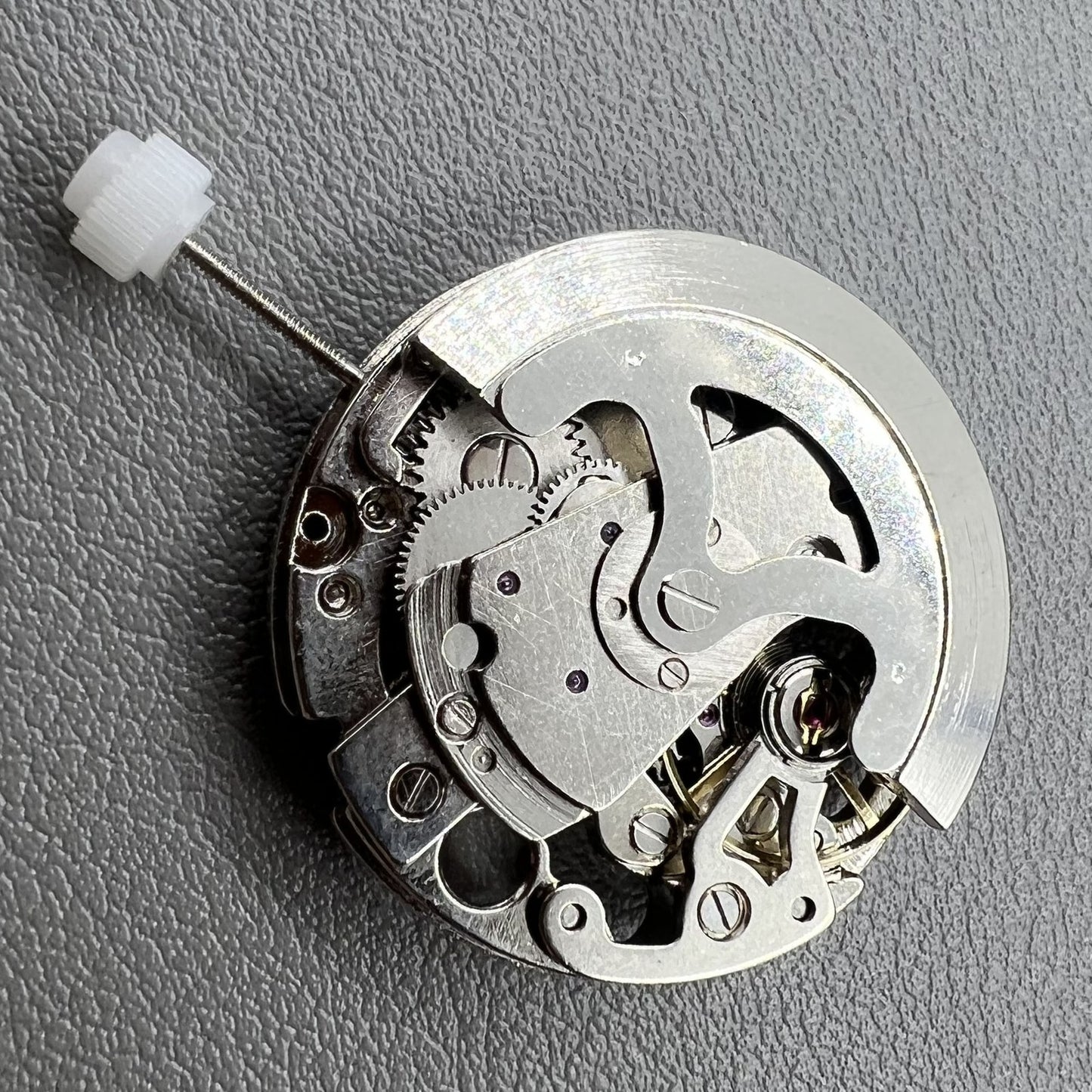 7120 Hollow silver automatic watch movement showcasing intricate mechanical gears and craftsmanship.
