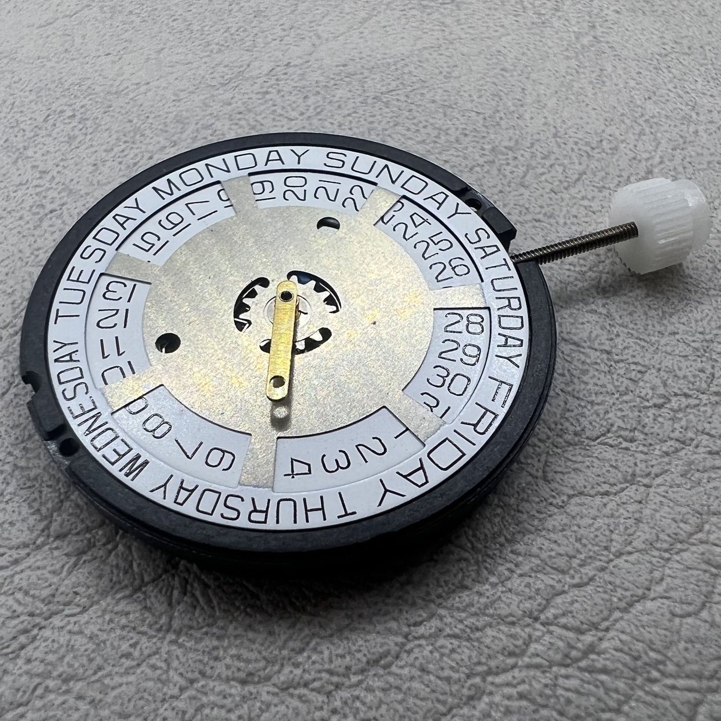 Swiss ETA 805 144 quartz movement watch with silver three hands and white dial, precise timekeeping.