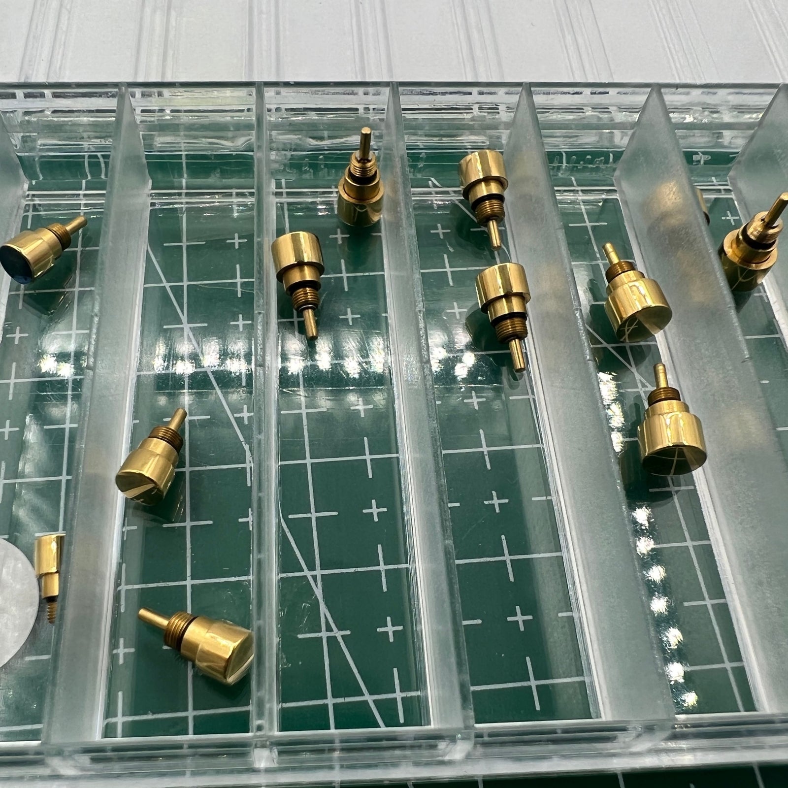 Golden stainless steel pusher drive watch accessory by Wholesale Watch, sleek and durable for classic timepieces.