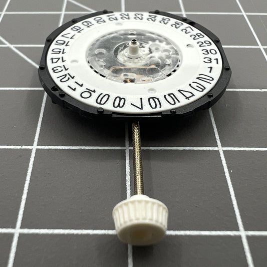 LG32 quartz watch movement with date display at 3 o'clock, precision repair part for watches.