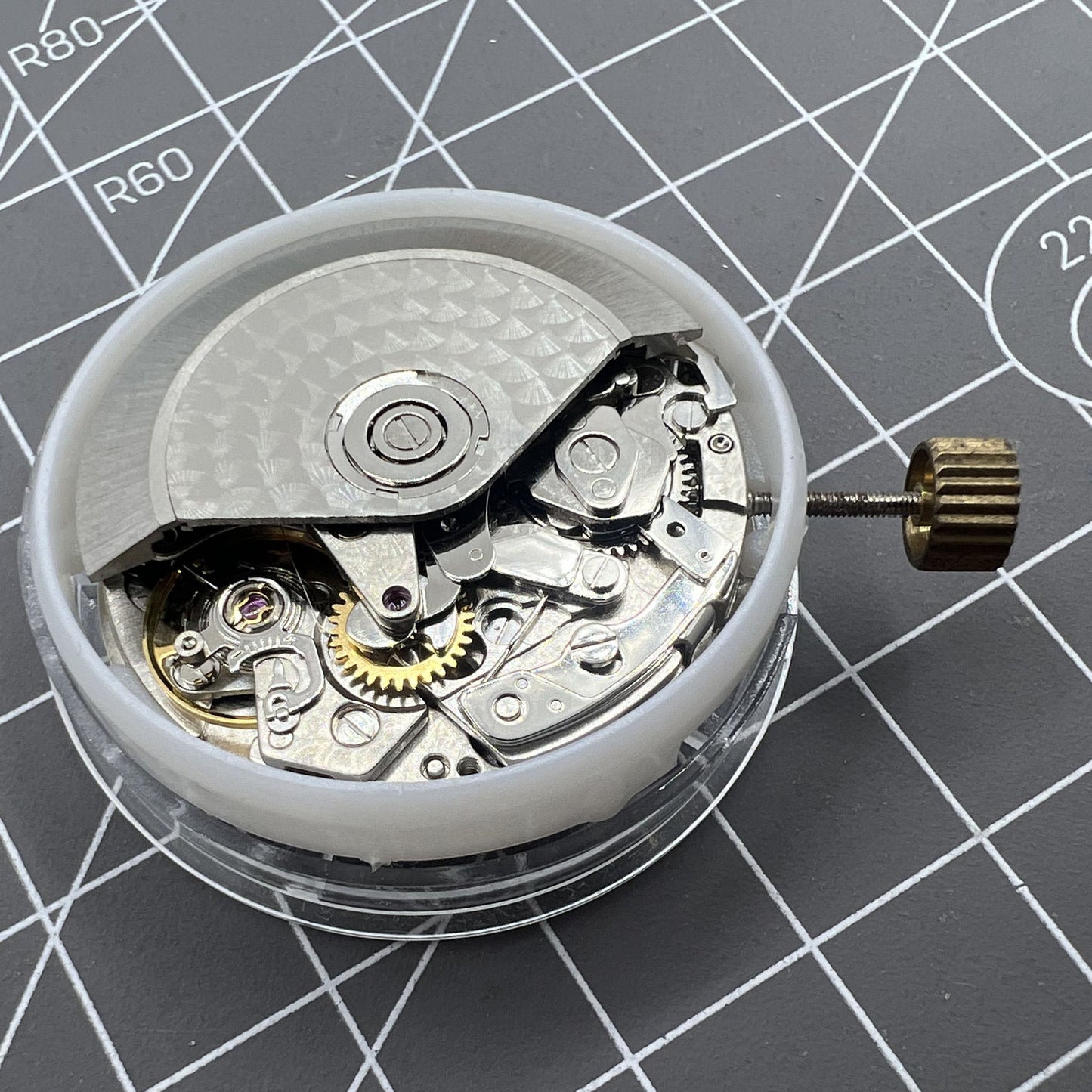 China Made 7750 Automatic Chronograph Movement by ETA displaying detailed gears at 3, 6, and 9 o'clock positions.