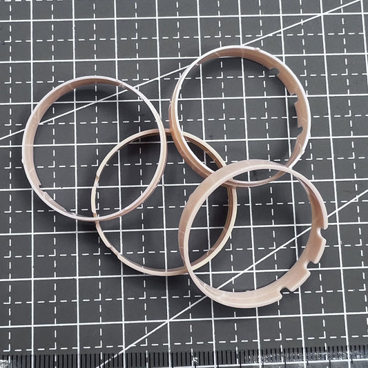 Set of 5 ETA G10.211 movement spacer rings for watch case mounting, ensuring secure fit.