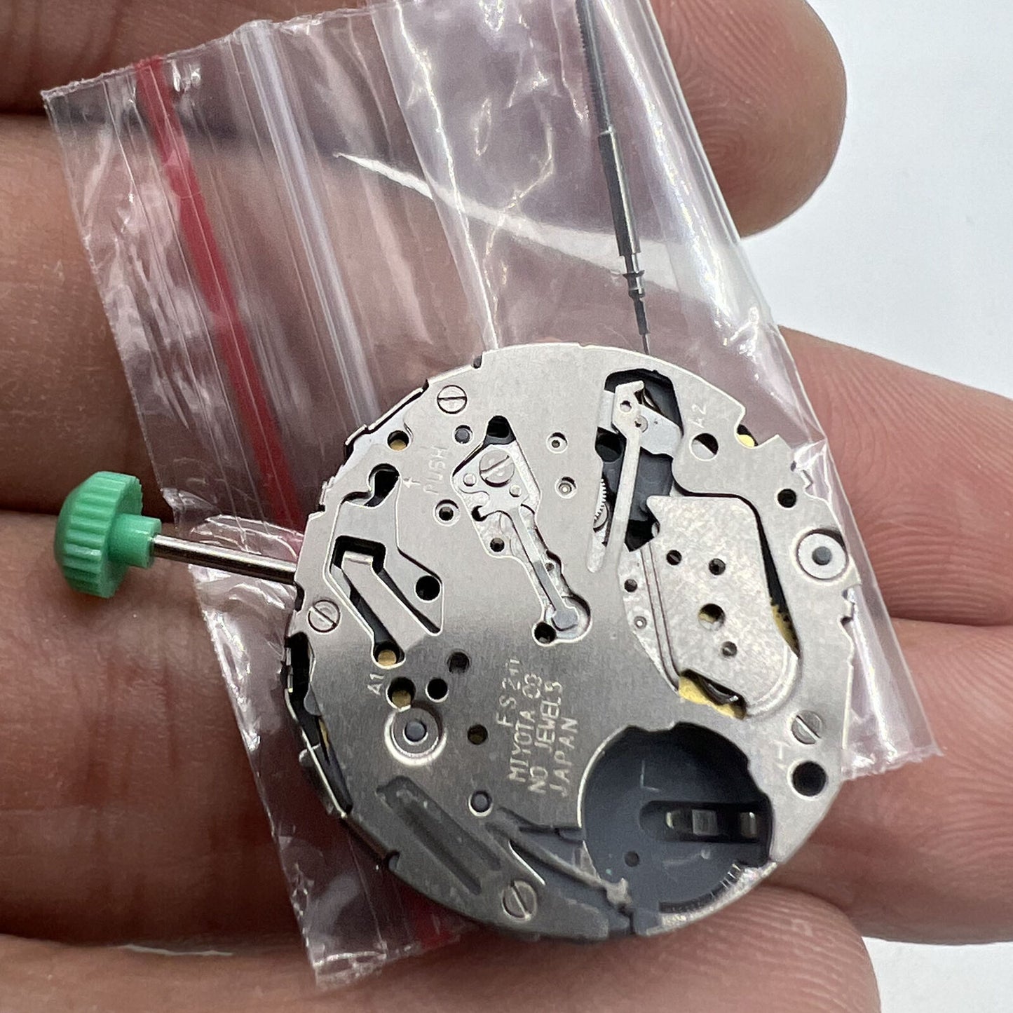 Miyota FS20 chronograph quartz watch movement with date display at 3, Japan-made precision by Miyota.