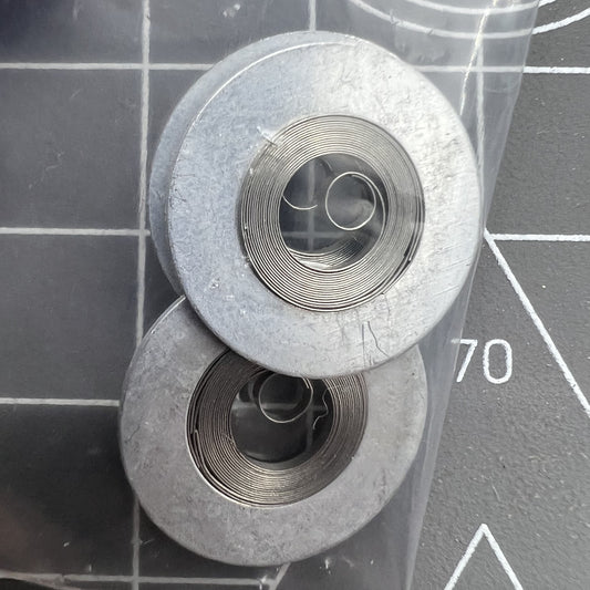 Silver mainspring compatible with Movement 7009#180, durable and precise watch accessory for accurate timekeeping.