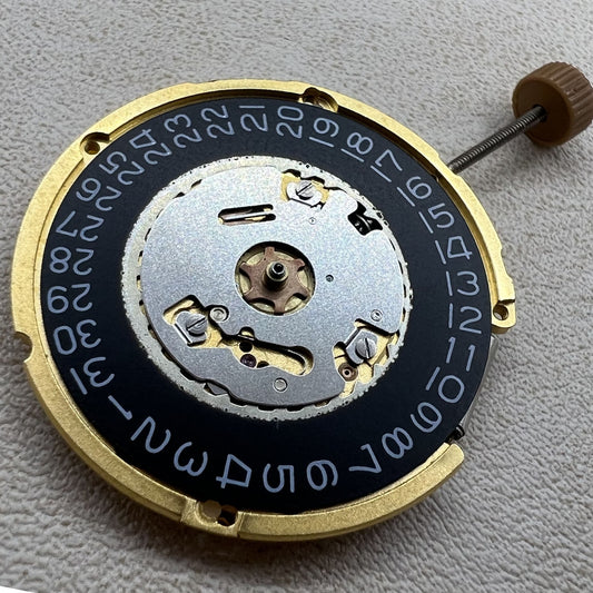 Swiss Ronda 6003.D quartz watch movement with 3 hands and single calendar on black dial.
