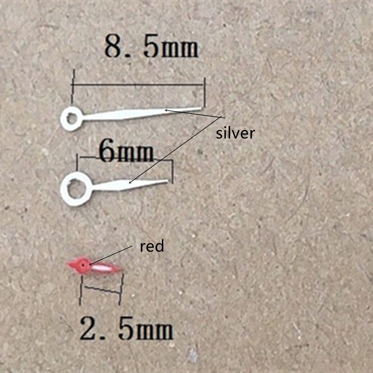Silver and red diamond-shaped watch hands by Miyota, compatible with 1L45 quartz movement for precise timekeeping.