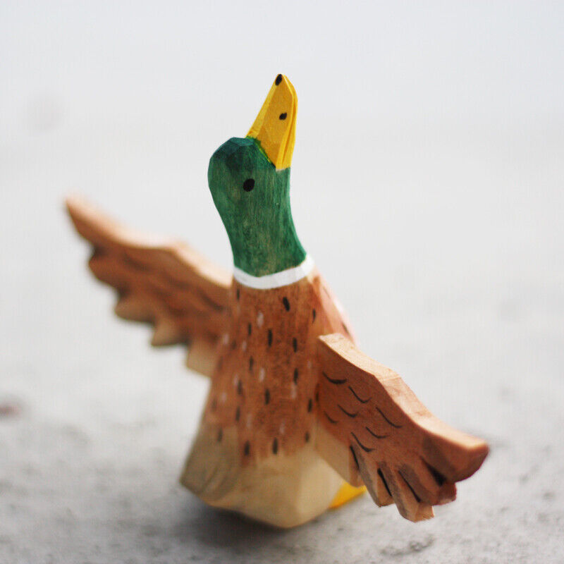 Handmade Flying Mallard wooden figurine, charming decor for watch accessory displays.