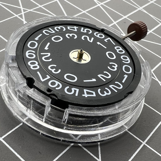 Swiss Ronda 509 quartz watch movement with black disk and date display at 3 o'clock, perfect for precise timekeeping.